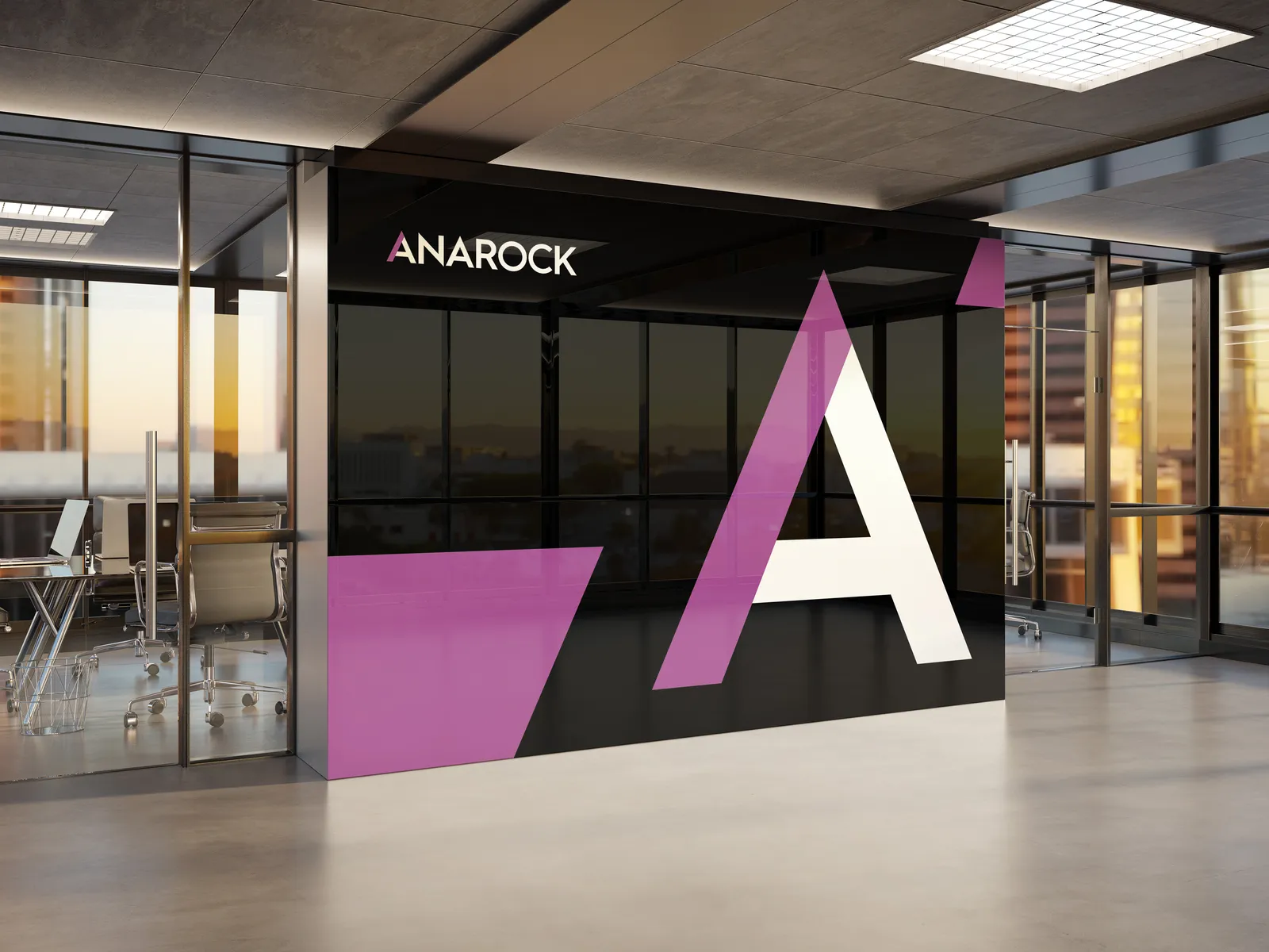 Anarock office entrance signage featuring the large-format A logo applied to glass and wall panels